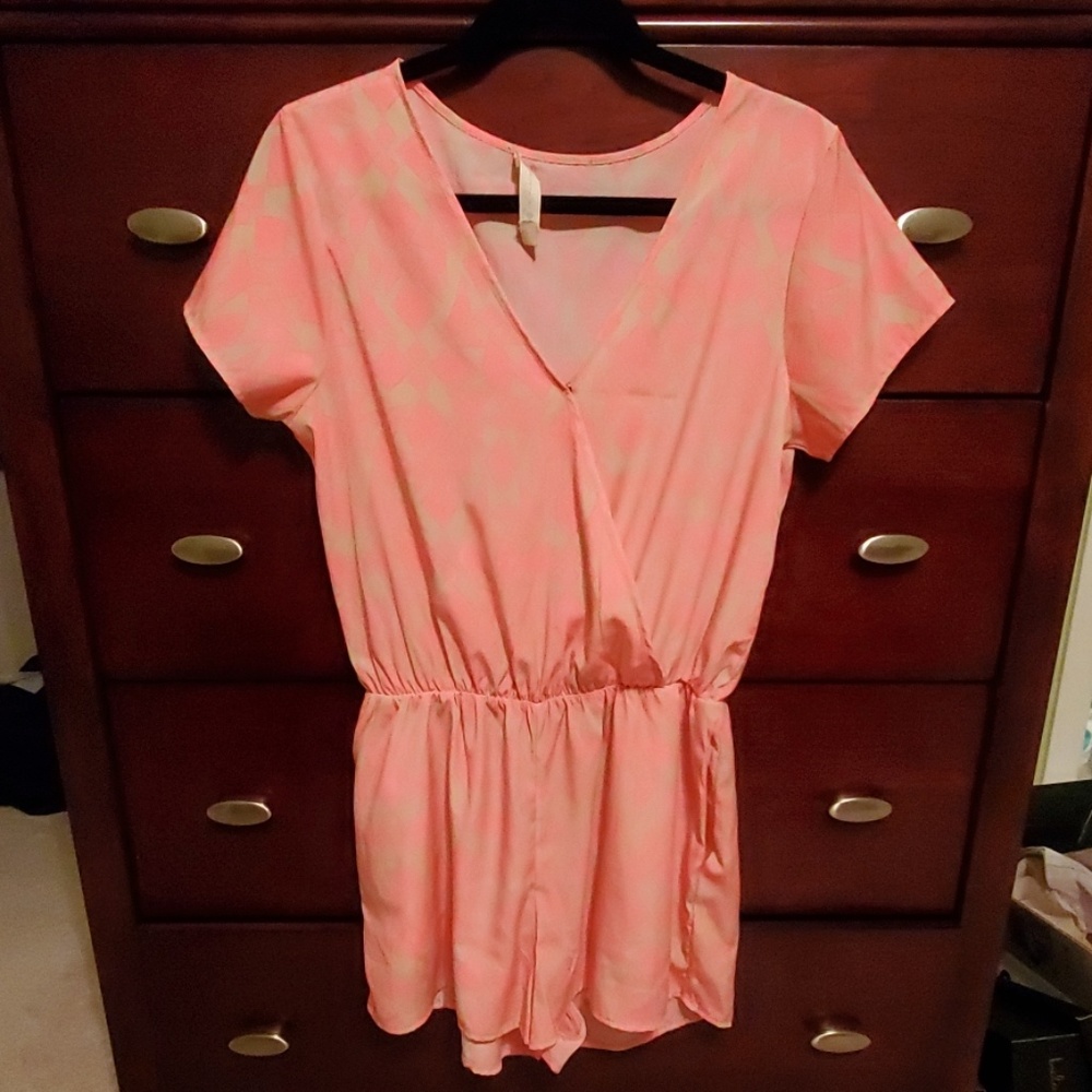 Neon pink romper with geometric print